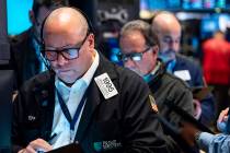 Traders work on the floor at the New York Stock Exchange in New York, Monday, March 13, 2023. ( ...