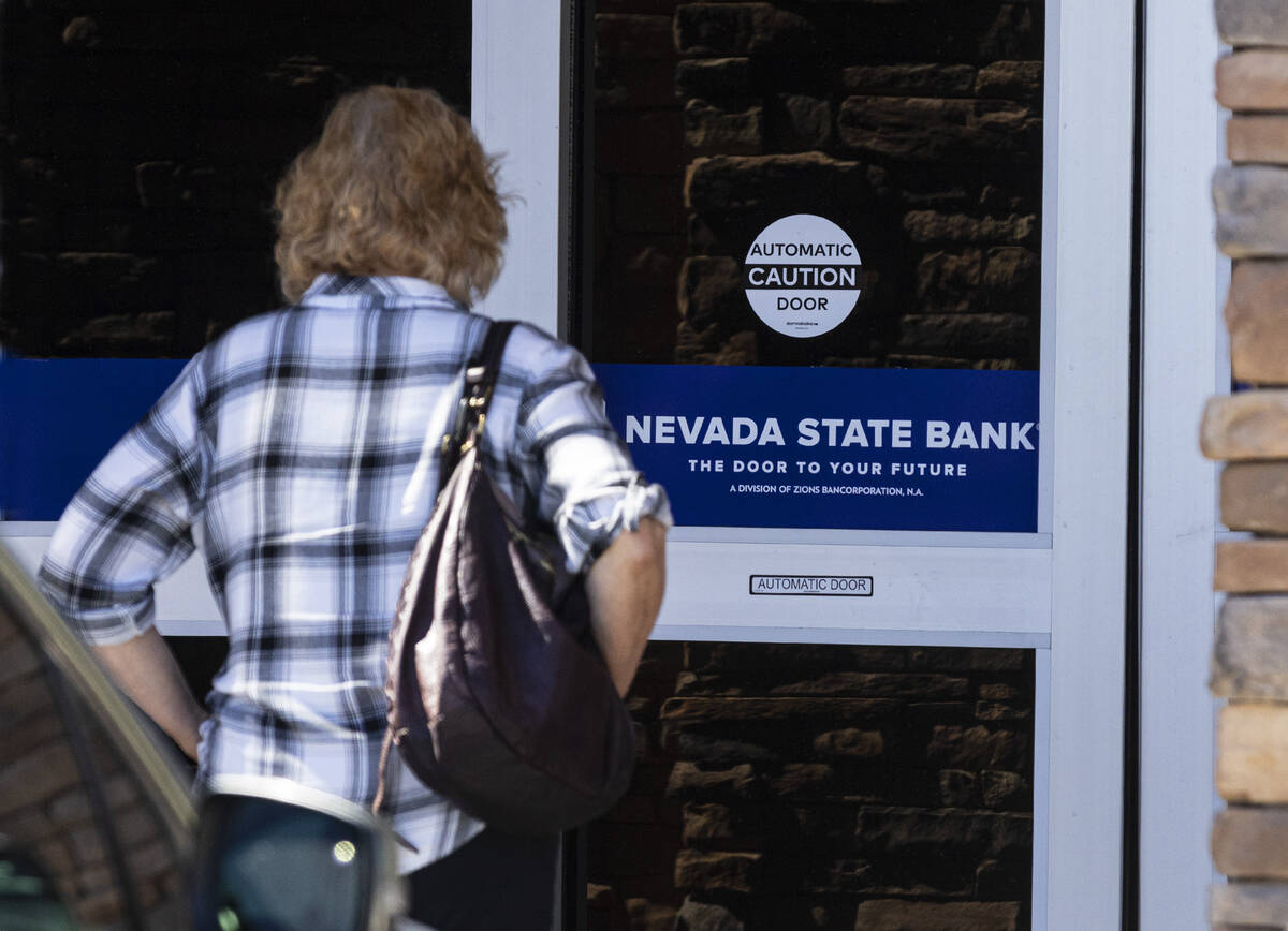 A customer enters the Nevada State Bank, on Monday, March 13, 2023, in Las Vegas. (Bizuayehu Te ...