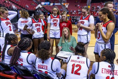 UNLV head coach Lindy La Rocque talks strategy in a huddle during the second half of their Moun ...