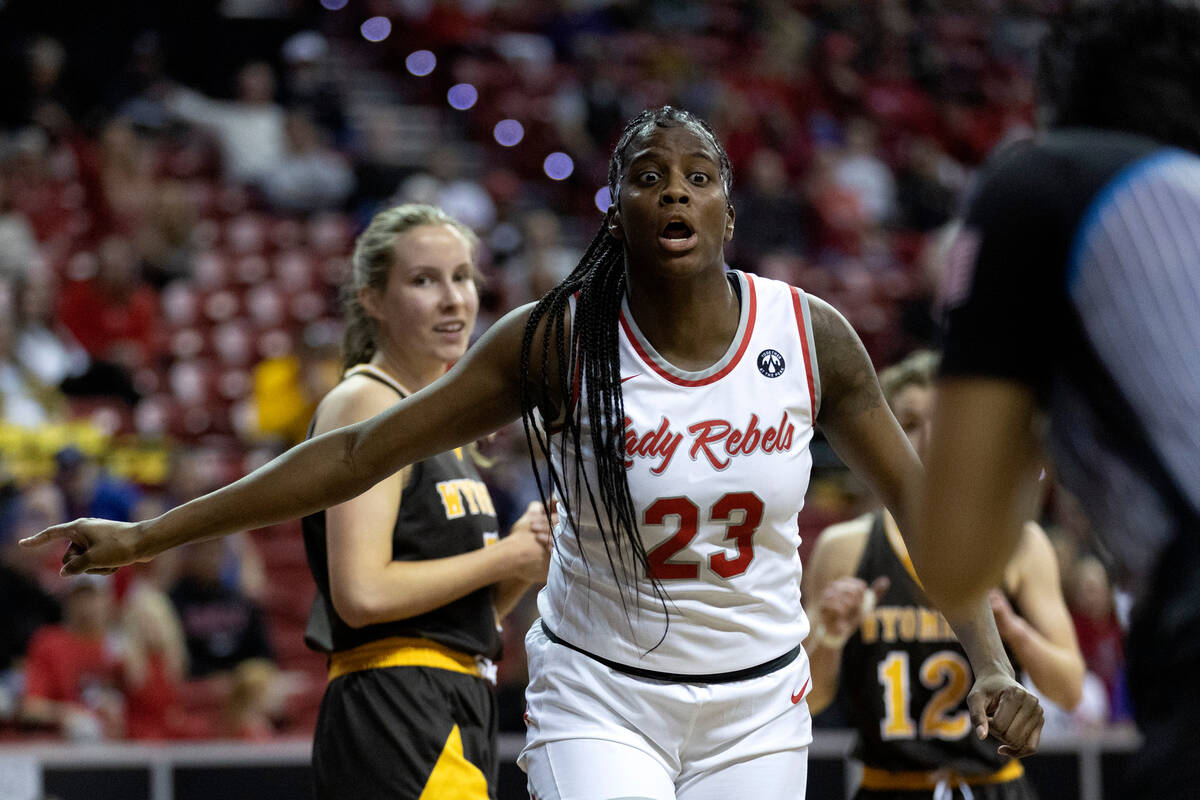 UNLV Lady Rebels center Desi-Rae Young (23) disputes an out-of-bounds call with a referee while ...