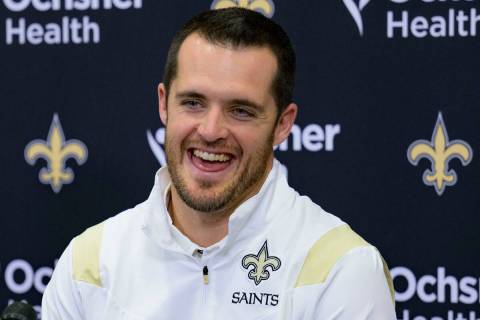Derek Carr smiles as he is introduced as the new quarterback of the New Orleans Saints during a ...