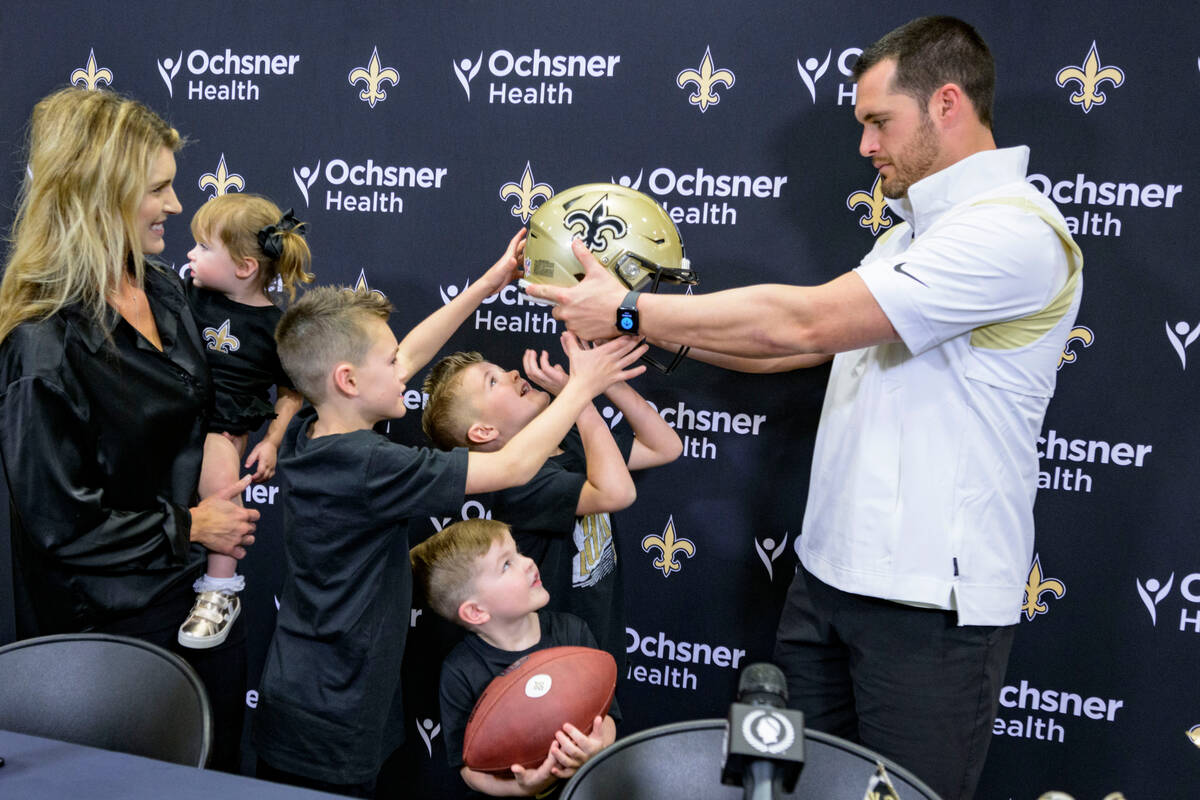 Derek Carr, the new quarterback of the New Orleans Saints NFL football team, is introduced with ...