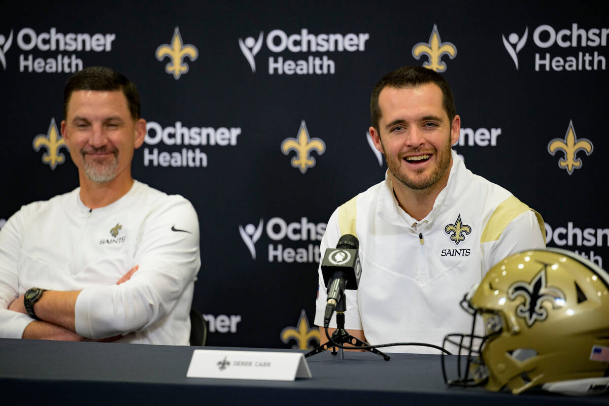 Derek Carr smiles as he is introduced as the new quarterback of the New Orleans Saints alongsid ...