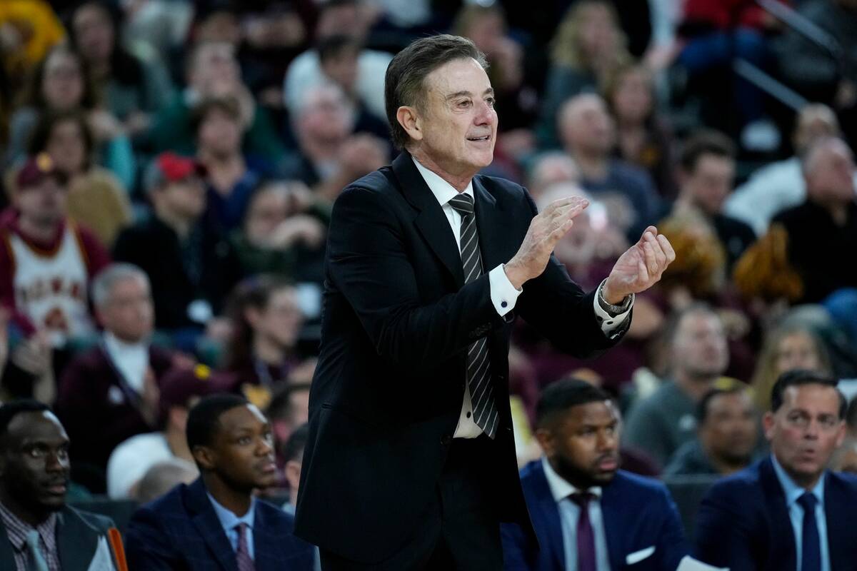 Iona head coach Rick Pitino calls out during the second half of an NCAA college basketball game ...