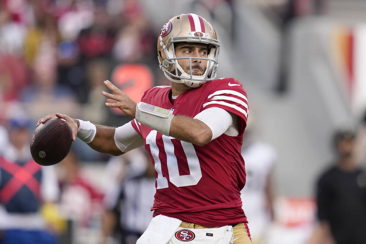 In this Nov. 27, 2022, file photo, San Francisco 49ers quarterback Jimmy Garoppolo (10) passes ...