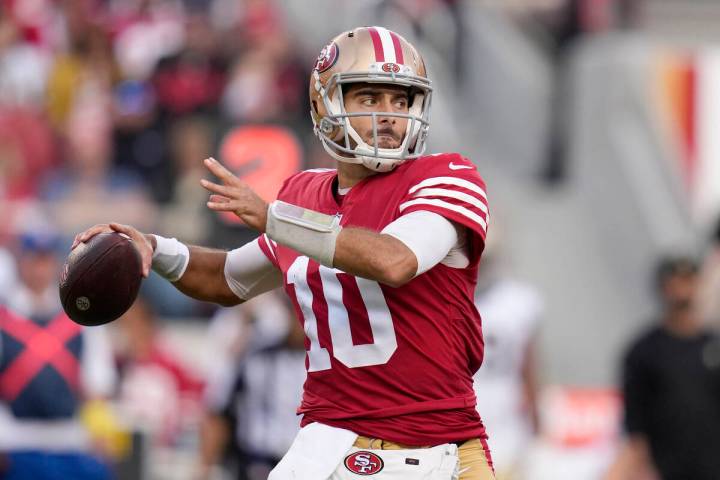 In this Nov. 27, 2022, file photo, San Francisco 49ers quarterback Jimmy Garoppolo (10) passes ...