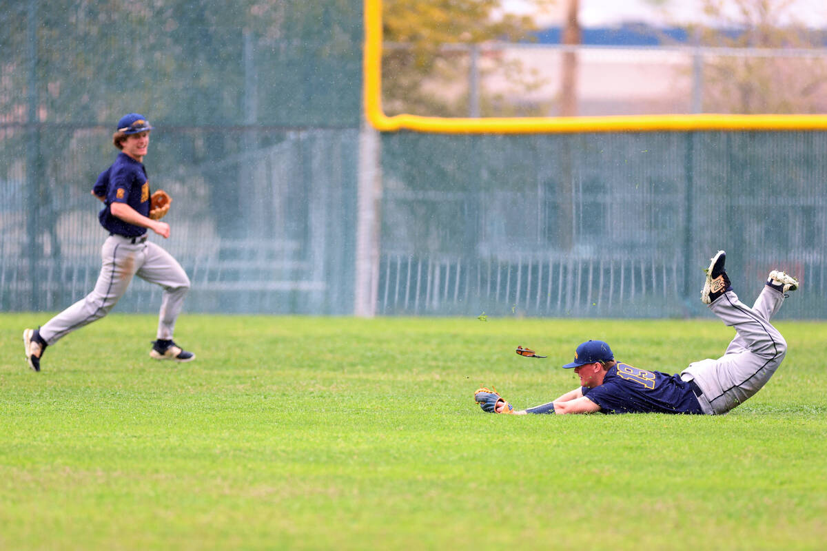Boulder City's Caleb Ramsay-Brown (19) makes a catch in the outfield for an out during a spring ...