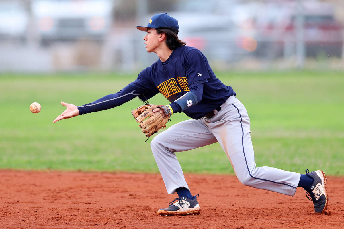 Boulder City's Landon Baker (46) tosses the ball to second base for an out during a spring brea ...