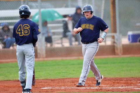 Boulder City's Steven Uszynski (17) walks to the home plate after hiring a two-run homer during ...