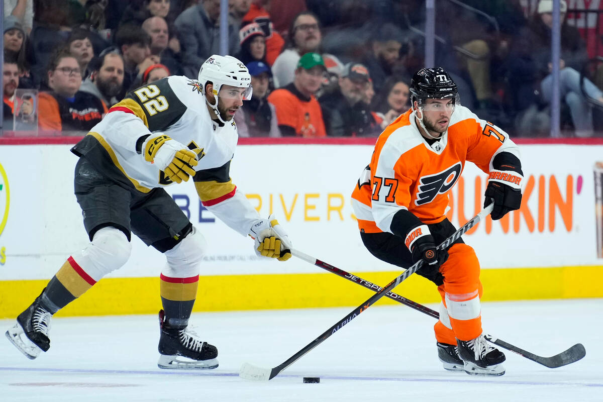 Philadelphia Flyers' Tony DeAngelo, right, tries to keep away from Vegas Golden Knights' Michae ...