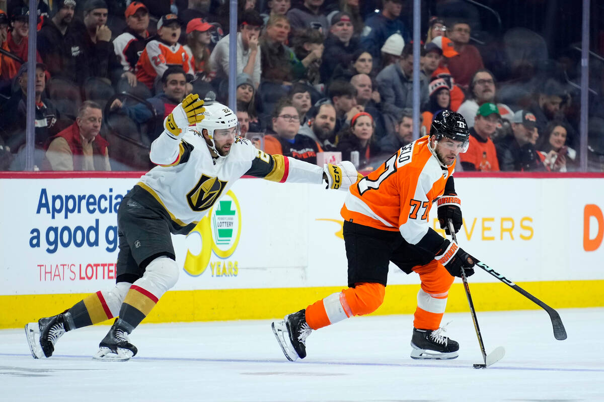 Vegas Golden Knights' Michael Amadio, left, tries to slow down Philadelphia Flyers' Tony DeAnge ...