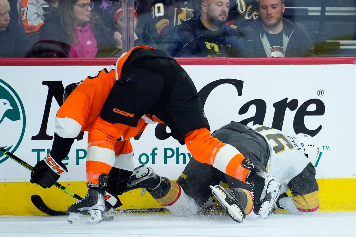 Philadelphia Flyers' Nick Seeler, left, and Vegas Golden Knights' Pavel Dorofeyev collide durin ...