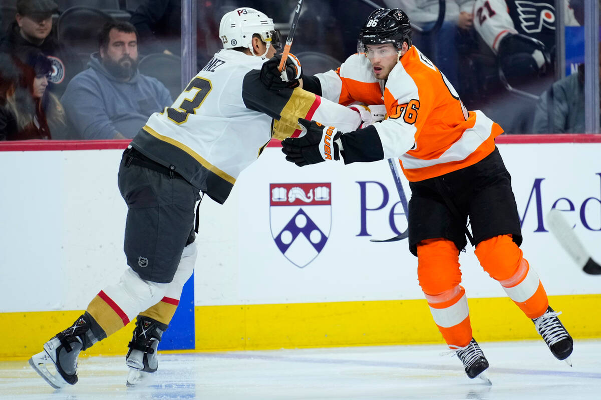 Vegas Golden Knights' Alec Martinez, left, and Philadelphia Flyers' Joel Farabee collide during ...