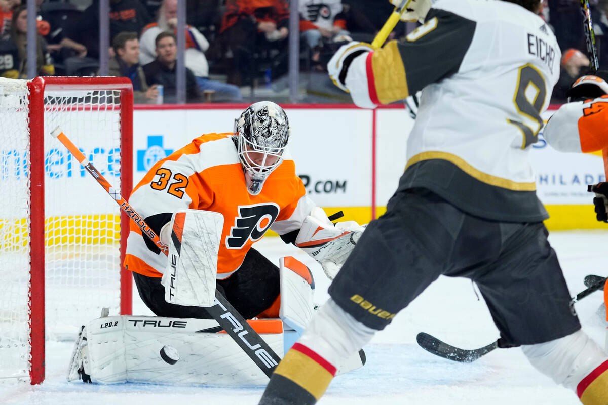 Philadelphia Flyers' Felix Sandstrom, left, blocks a shot during the first period of an NHL hoc ...