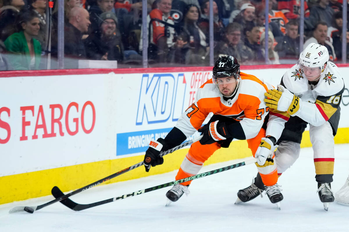Philadelphia Flyers' Tony DeAngelo, left, tries to get past Vegas Golden Knights' Pavel Dorofey ...