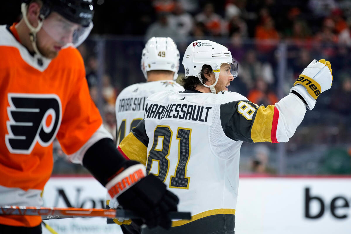Vegas Golden Knights' Jonathan Marchessault, right, celebrates after scoring a goal during the ...