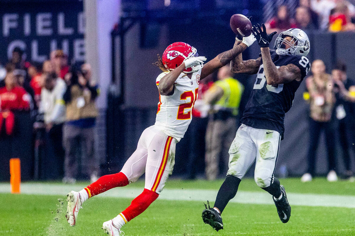Kansas City Chiefs safety Justin Reid (20) breaks ups long pass to Raiders tight end Darren Wal ...