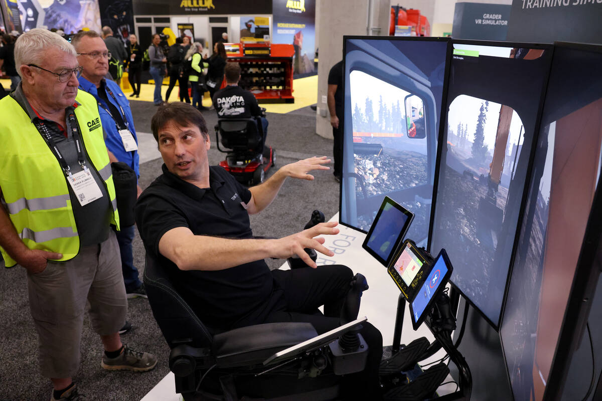 Freddy Lund, CEO of Tenstar Simulation, shows a construction site training simulator the West H ...
