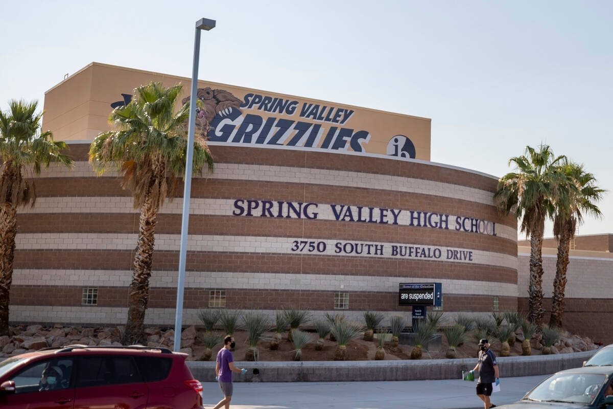 Spring Valley High School school staff distributes Chromebooks to students, at Spring Valley Hi ...