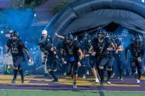 Faith Lutheran players take the field versus Liberty for the first half of their NIAA football ...