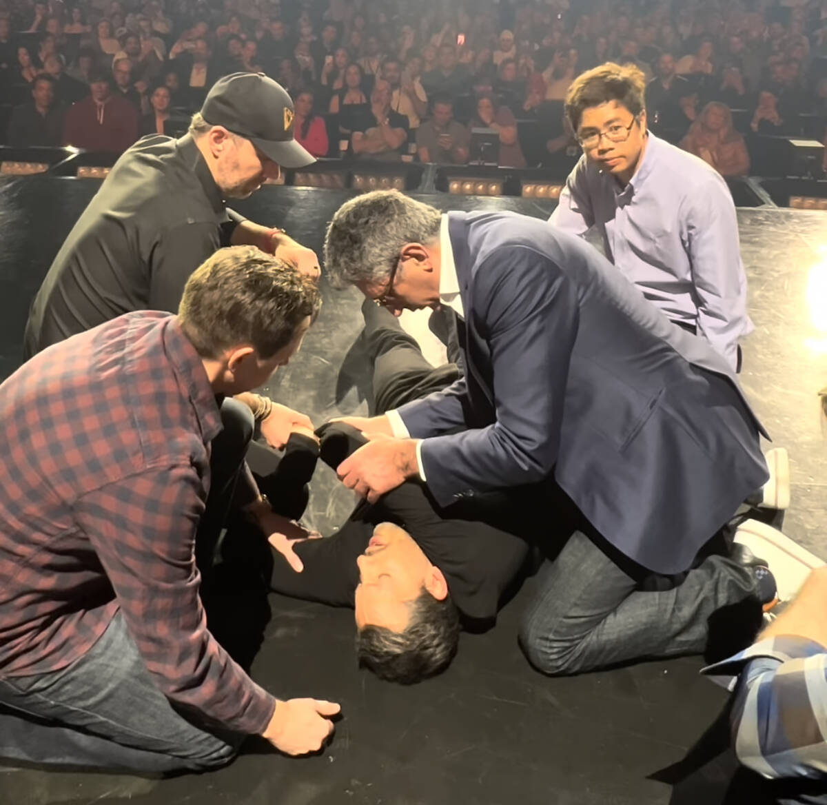 David Blaine is treated onstage at Resorts World Theatre after suffering a separated shoulder i ...