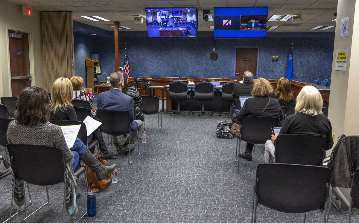 Attendees listen to comments during a Nevada Health & Human Services Committee hearing on the E ...
