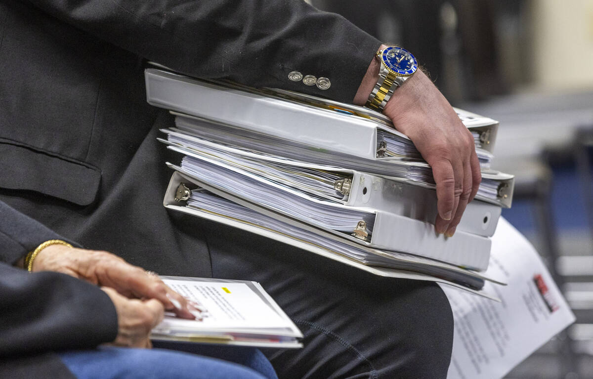 Binders of support signatures are to be presented during a Nevada Health & Human Services Commi ...