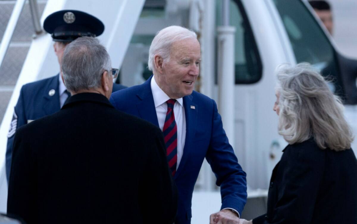 President Joe Biden greets Rep. Dina Titus, D-Nev., as he arrives at Harry Reid International A ...