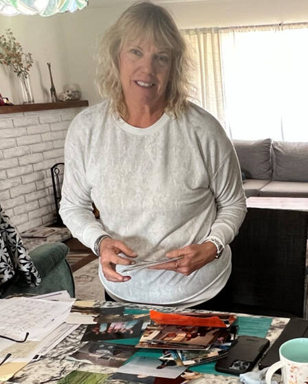 Bob Wildoner's wife Cindy Lee. with pictures of her missing husband. Photo courtesy of Wildoner ...