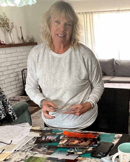 Bob Wildoner's wife Cindy Lee. with pictures of her missing husband. (courtesy)