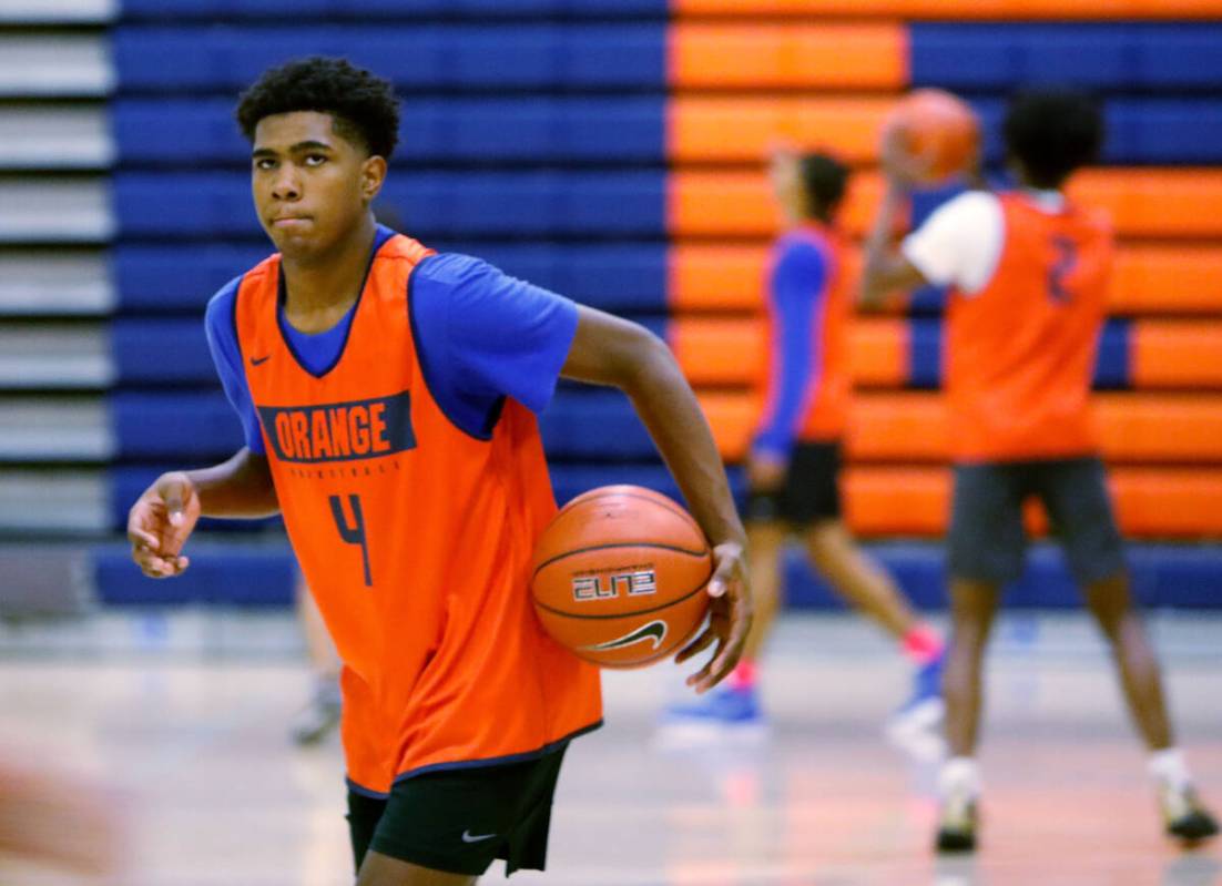 Jase Richardson holds the ball during a basketball practice at Bishop Gorman High School, Frida ...