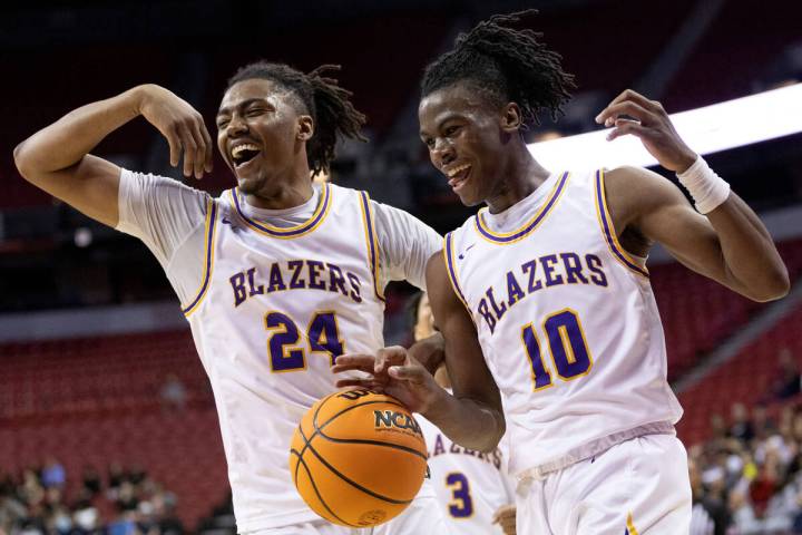 Durango’s Taj Degourville (24) and Tylen Riley (1) celebrate during the final seconds in ...