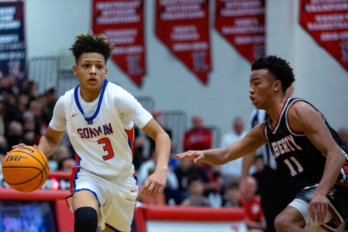 Bishop Gorman’s John Mobley Jr. (3) dribbles past Liberty’s Dedan Thomas (11) dur ...