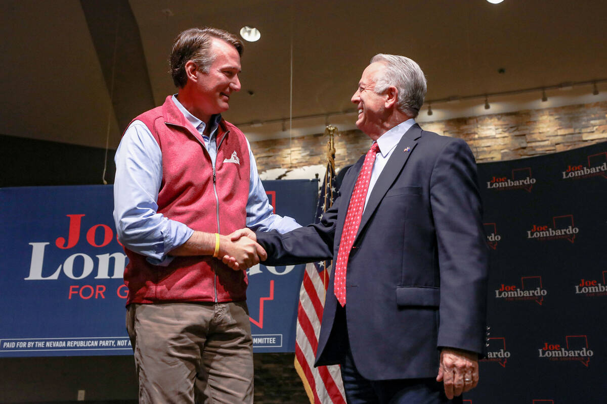 Virginia Gov. Glenn Youngkin, left, shakes hands with Republican candidate for governor Sheriff ...