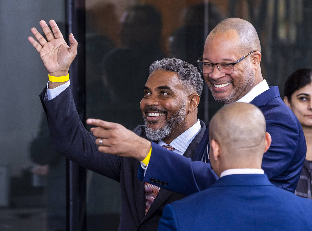 Attorney General Aaron Ford and Congressman Steven Horsford greet the crowd as they arrive to h ...
