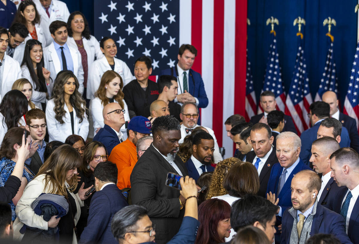 President Joe Biden greets attendees after talking about lowering prescription drug costs durin ...