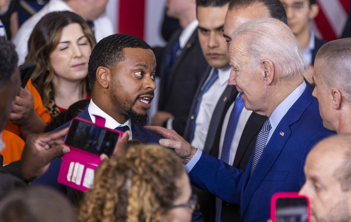 President Joe Biden chats with Clark County Commissioner William McCurdy II after speaking abou ...