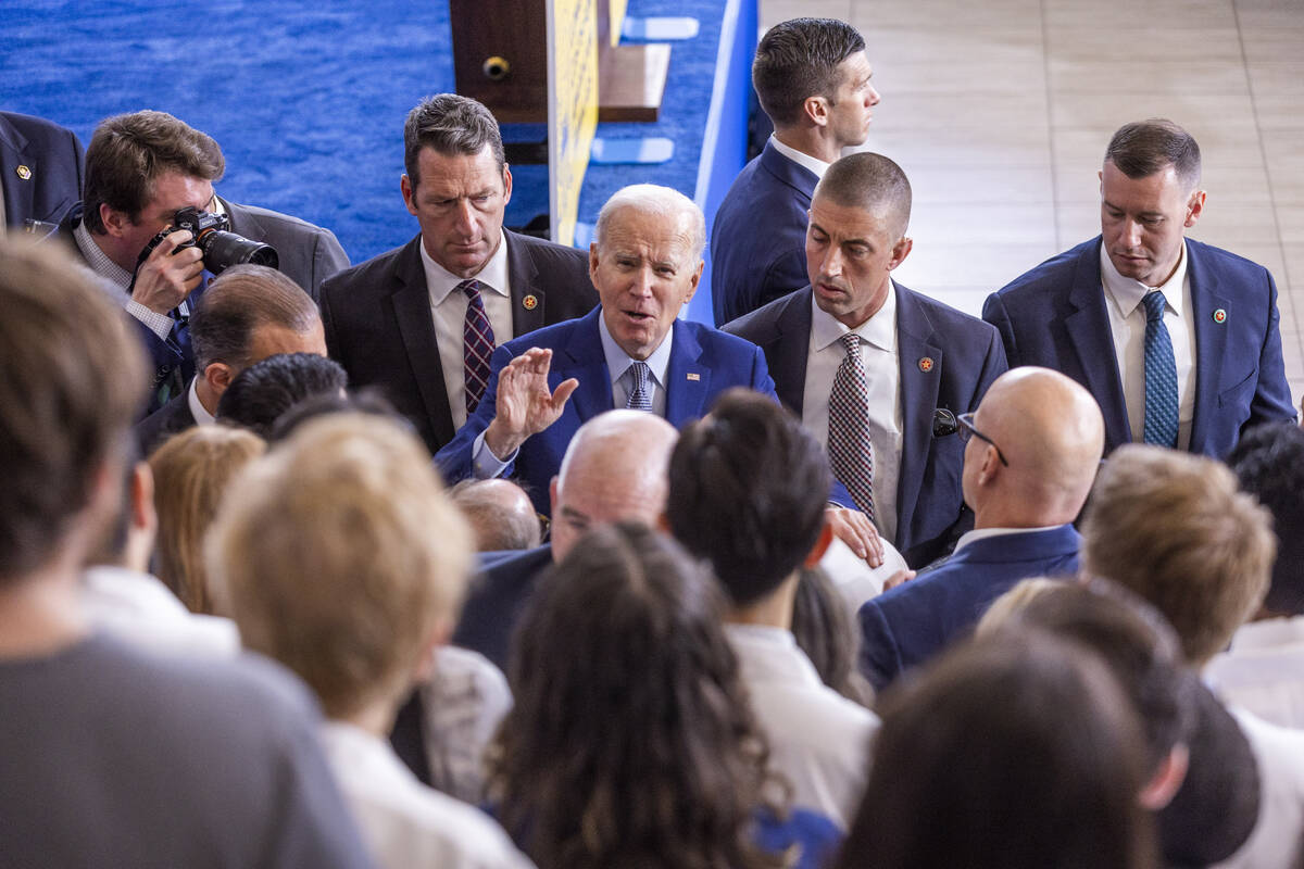 President Joe Biden talks with UNLV medical staff and students after speaking about lowering pr ...
