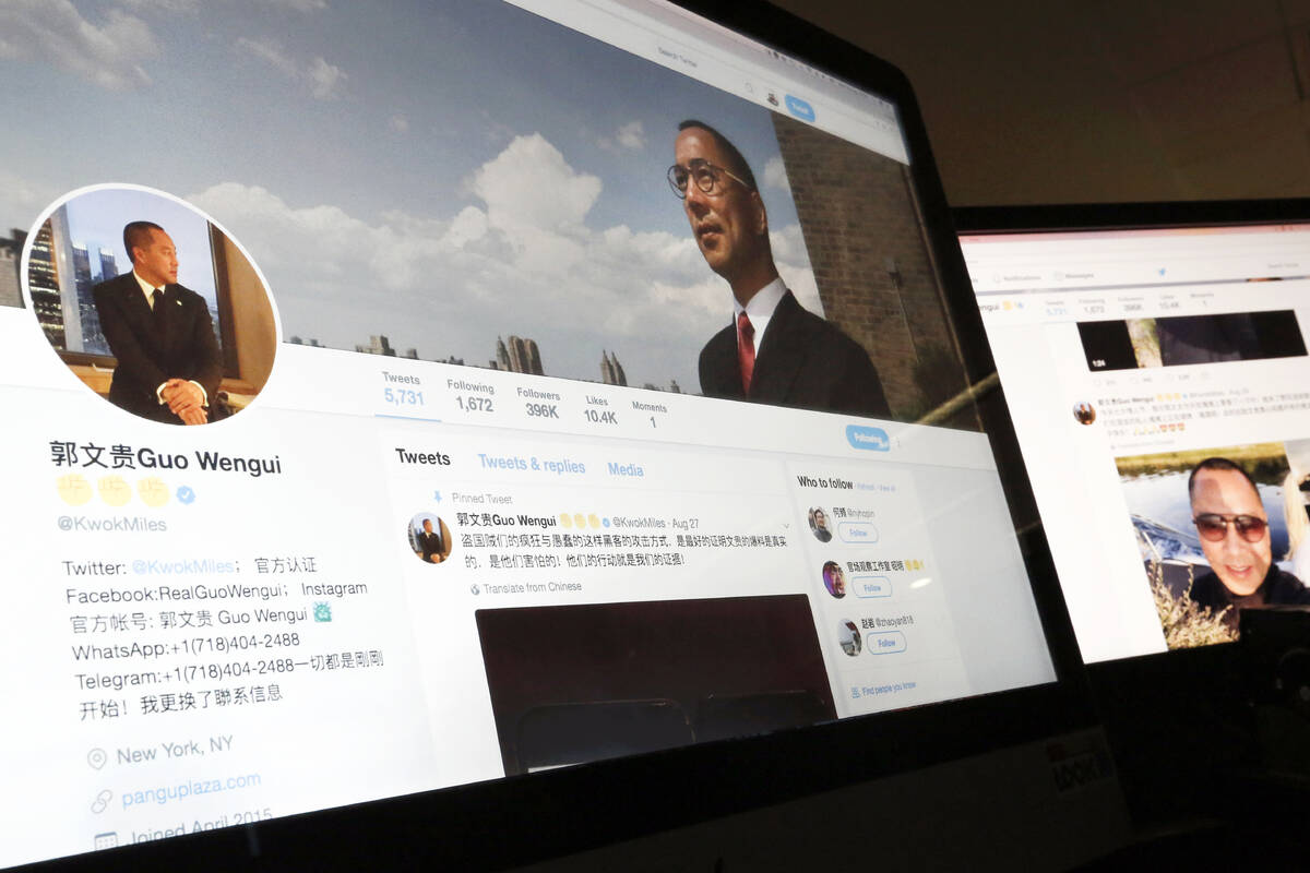 FILE - A Twitter page of Chinese exiled businessman Guo Wengui is seen on a computer screen in ...
