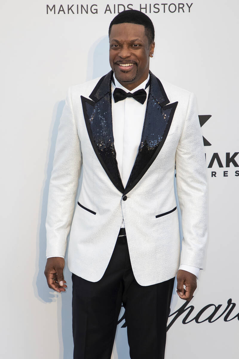 Chris Tucker poses for photographers upon arrival at the amfAR, Cinema Against AIDS, benefit at ...
