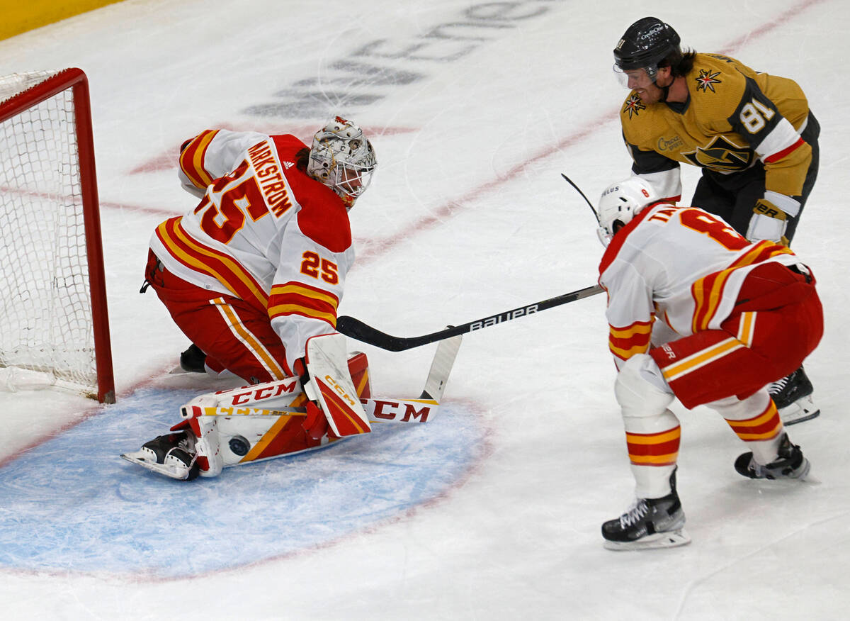 Calgary Flames goaltender Jacob Markstrom (25) makes a save against Vegas Golden Knights right ...