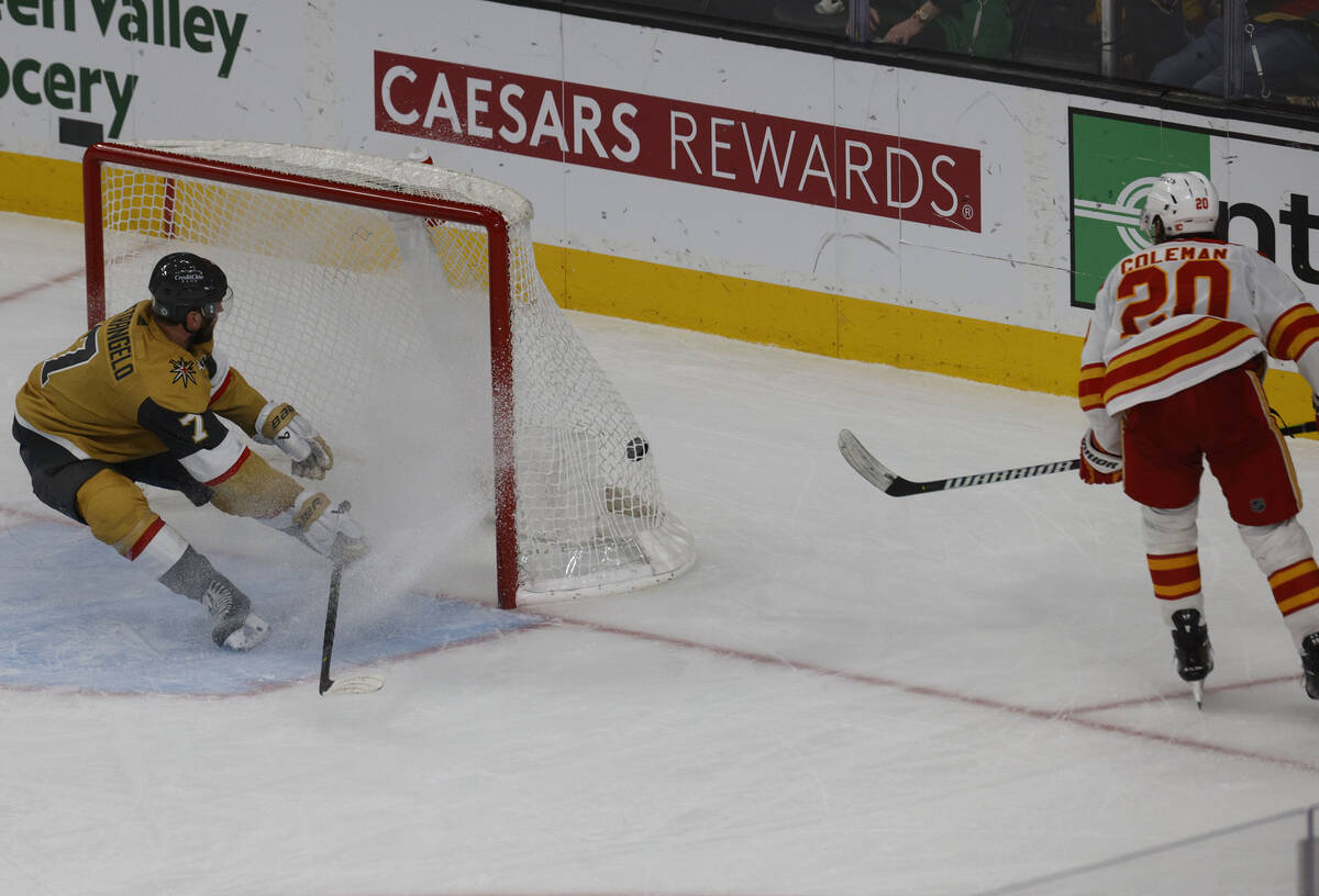Calgary Flames center Blake Coleman (20) scores a goal as Vegas Golden Knights defenseman Alex ...
