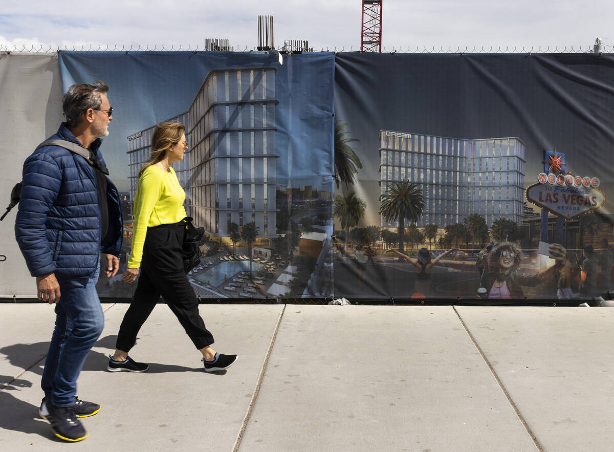 Pedestrian walk past a rendering of the Dream Las Vegas hotel-casino at the construction site a ...