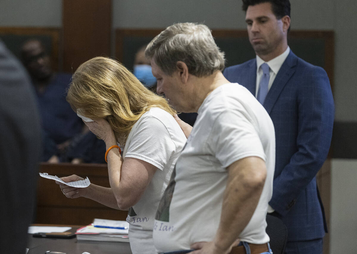 Cindy Peters is comforted by her husband Mark, parent of Rebekah Peters, a murder victim, as sh ...