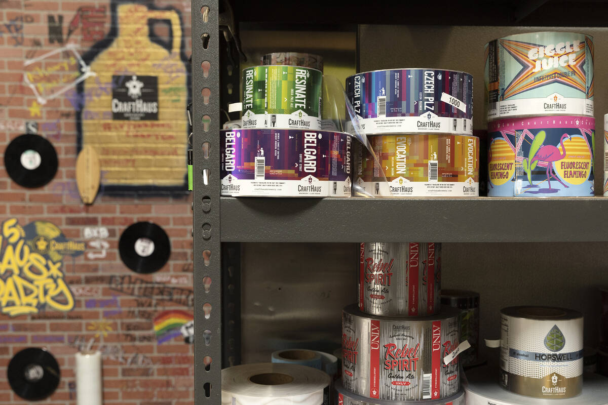Labels for different brews are stocked at CraftHaus Brewery on Wednesday, March 15, 2023, in He ...