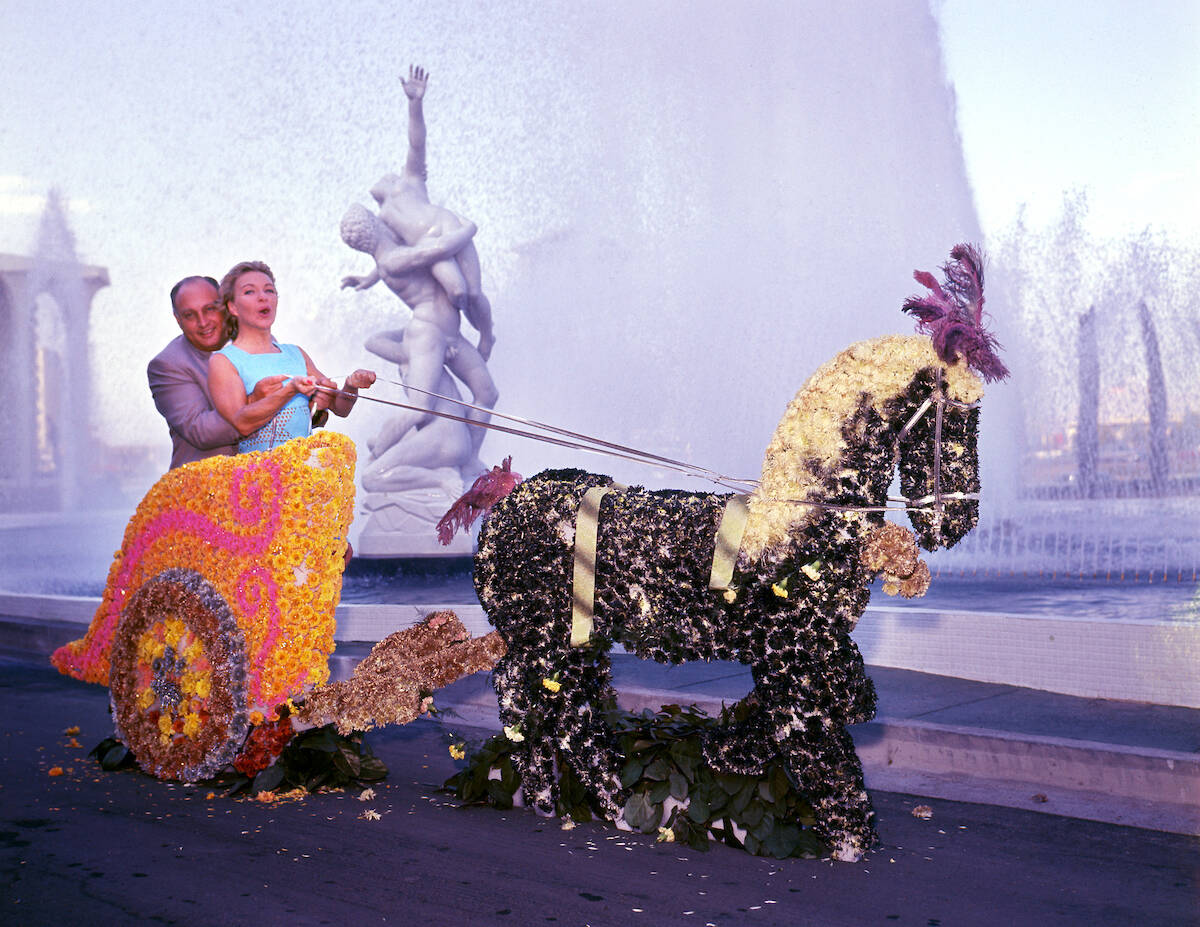 Jay Sarno and Line Renaud pose in a chariot near the fountains and replica of the Giambologna s ...