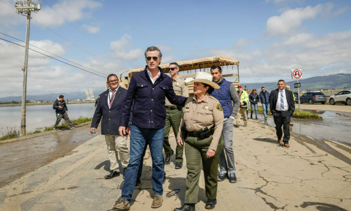 California Gov. Gavin Newsom walks with Monterey County Sheriff Tina Nieto before speaking to m ...
