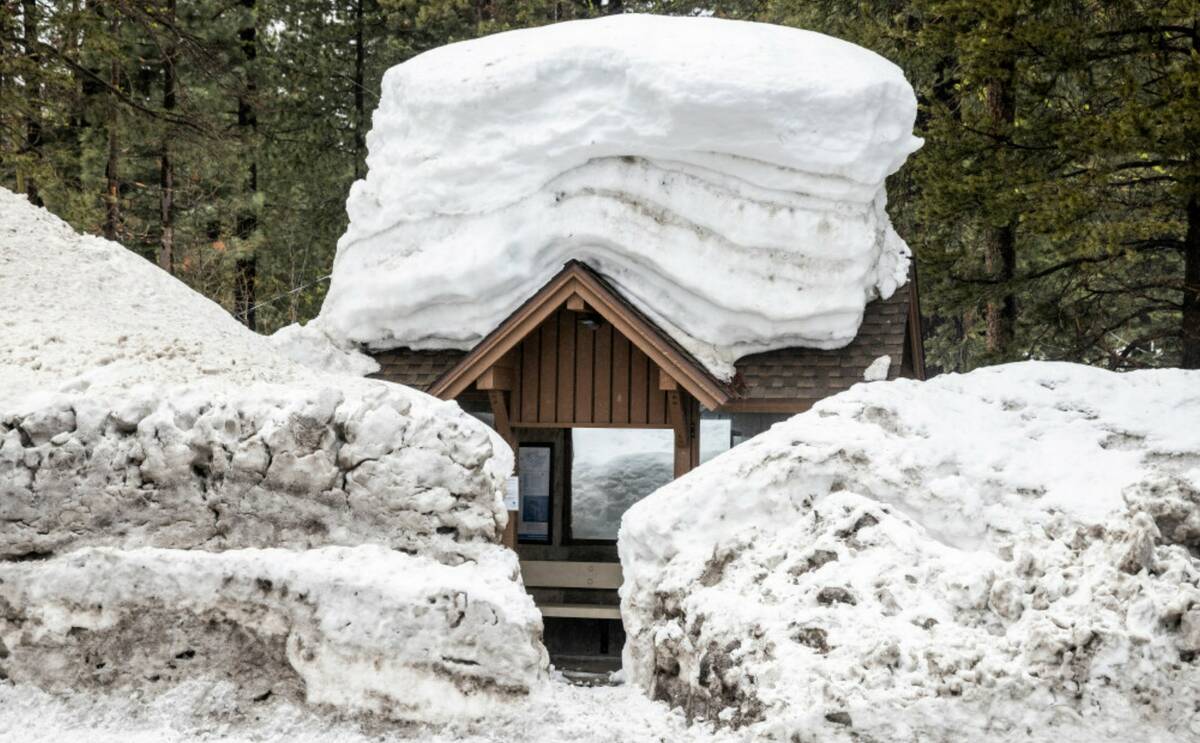 A bus stop surrounded by snow is seen in Tahoe City, Calif. Tuesday, March 14, 2023. (Stephen L ...