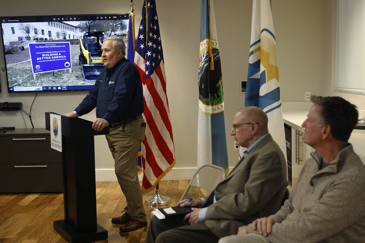 David Arend of the Bureau of Reclamation, left, speaks during a groundbreaking on a xeriscape p ...