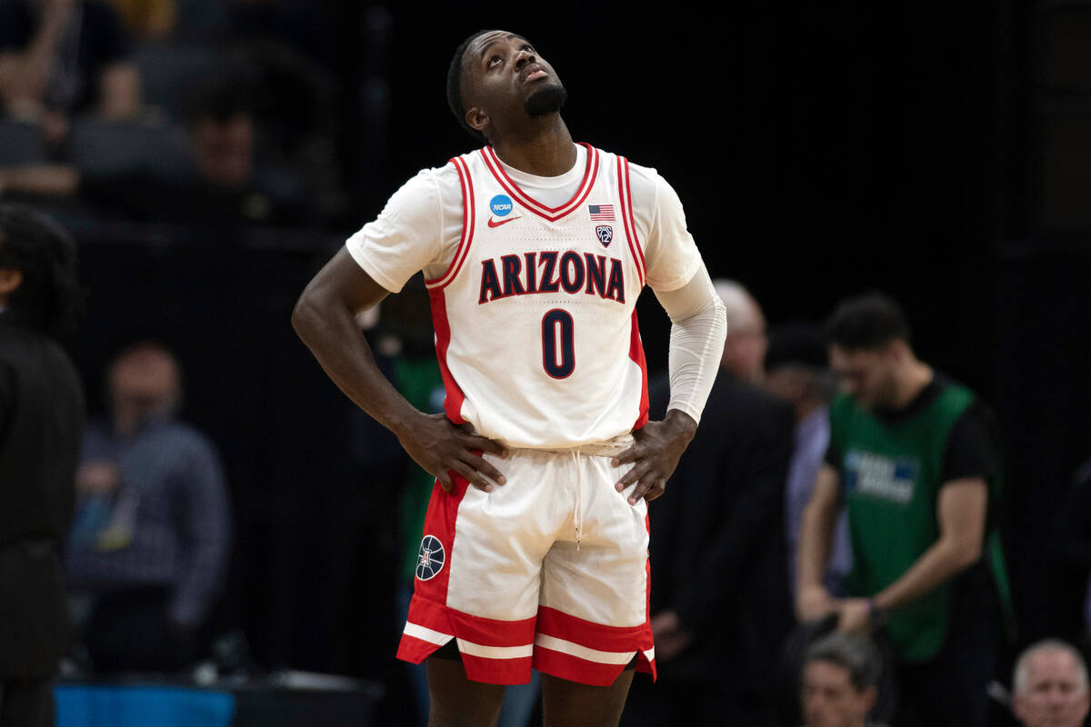 Arizona guard Courtney Ramey (0) looks up at the scoreboard during the second half of a first-r ...